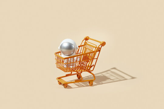 Toy cosmonaut inside shopping trolley