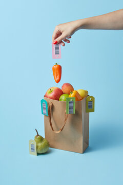 Woman holding pepper with barcode