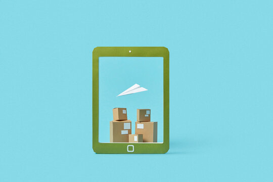 Boxes and paperplane in tablet frame