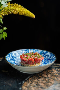 Beef tartar on blue plate