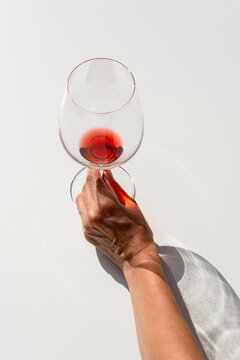 Person with glass of wine