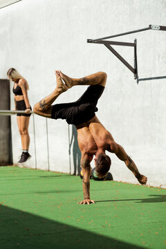 Man and woman doing a workout in a Gym outdoor