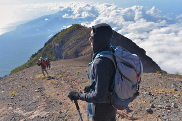Man with a backpack on the mountain