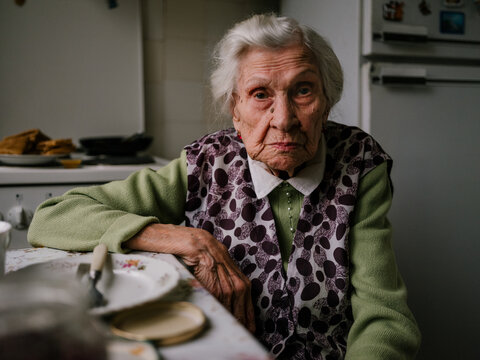 Grandma talking at the kitchen grumpy