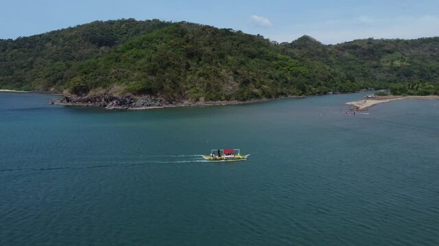 Drone tracking shot of a boat in Batangas, Philippines