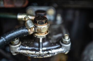 A close-up of a part of the tractor's engine