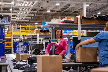 Employees chatting at work at warehouse 
