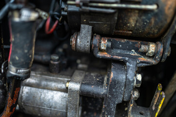 A close-up of a part of the tractor's engine