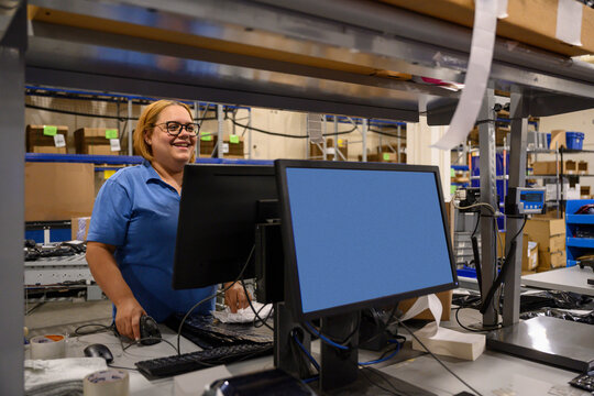  Employee Portrait at E-commerce facility at desk 