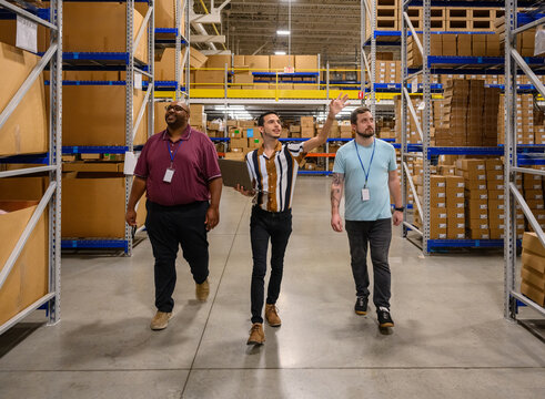 Manager leading meeting with employees at workplace 