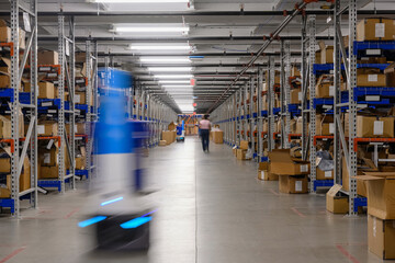 Robots move on floor at Ecommerce  Warehouse 