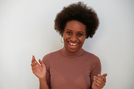 Beautiful woman laughing on a white background