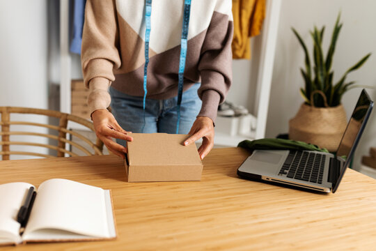 Freelancer woman packing order
