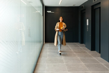 Business woman leaving office at lunch time