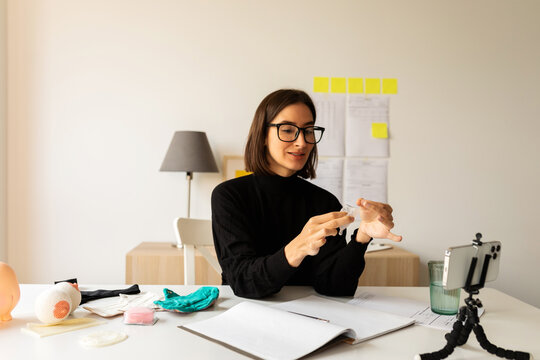 Gynecologist testing menstrual cup