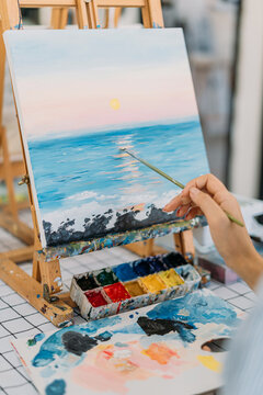 Close up photo of woman hand painting