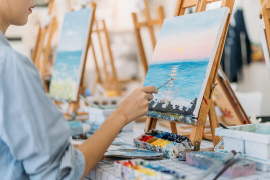 Close up photo of woman hand painting