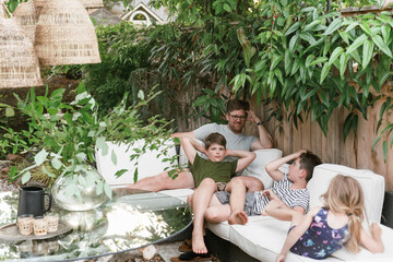 family lounges in outdoor landscaping