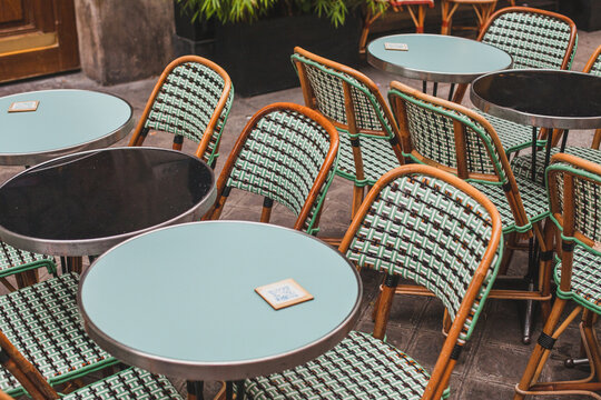 round tables on restaurant terrace in Paris, France