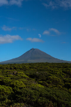 Volcano with a moon in the afternoon