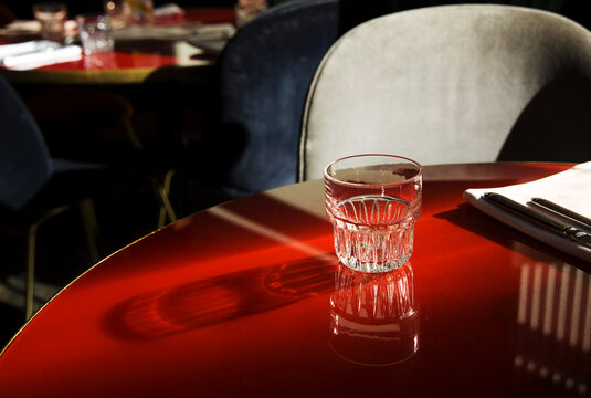 Glass on a red table 
