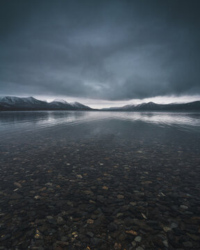 Cloudy dark landscape on the cold lake