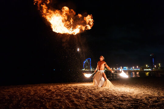 tribal man blows huge balls of fire