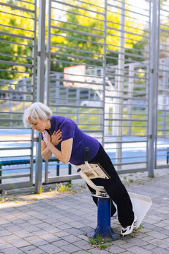 Active woman using sport simulator while training alone
