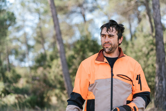 Tired woodcutter in forest
