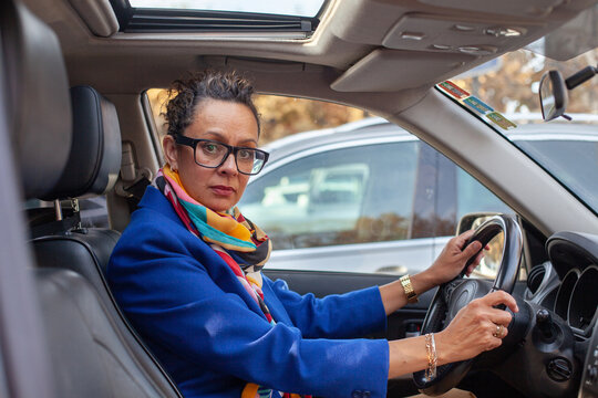 mature serious business woman portrait in the car