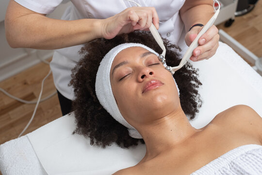 Woman Having A Facial Electro Treatment Close Up
