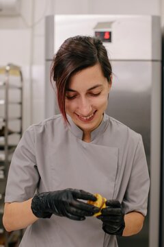 Cheerful female backer at work