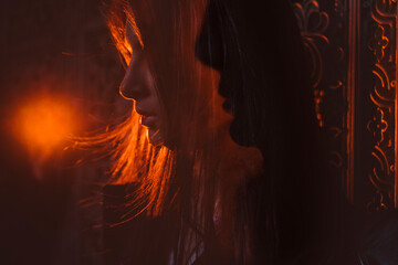 Side portrait in red.