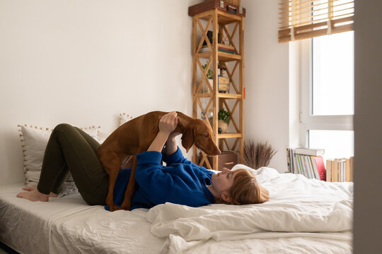 Woman Having Fun With Her Dog