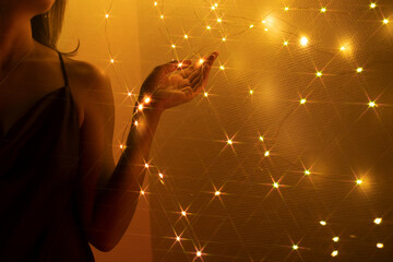 Anonymous woman surrounded by lights