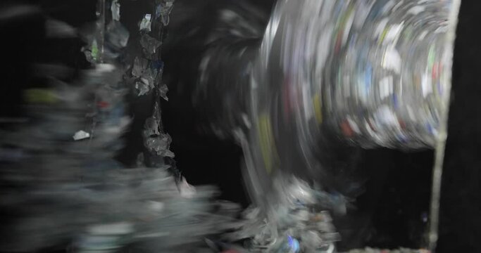 Close-up of plastic shredder. Recycling. The rotor rotates crushing the plastic into small pieces. Waste shredder. Environmental protection concept.