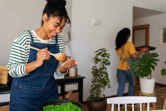 Latina cook tasting food