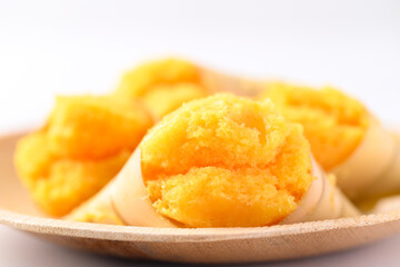 Homemade Toddy palm cake on natural plate with white background, Thai traditional dessert