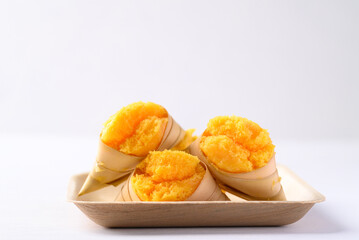 Homemade Toddy palm cake on natural plate with white background, Thai traditional dessert