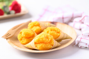 Homemade Toddy palm cake on natural dish with white background, Thai traditional dessert