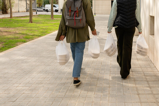Food delivery women by the street