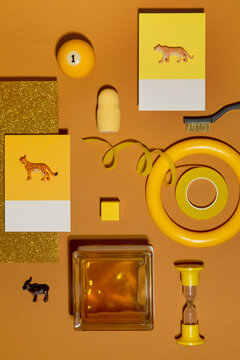 Yellow set with doll, billiard ball, toy animals, etc.