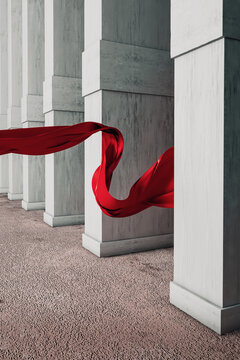 Red fabric flying between columns