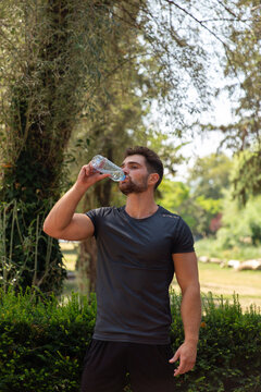 Man Drinking Water After A Workout