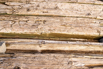 Aged wooden timbers from an abandoned dock .  Ideal background design element.