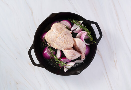 Raw Whole Chicken in Skillet From Above 