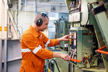 Marine engineer in engine control room