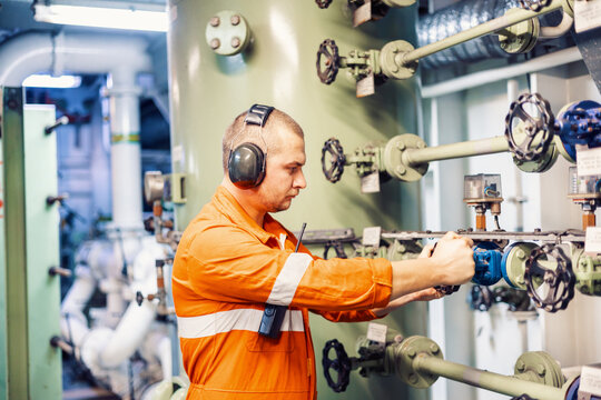 mechanic checks the piping system