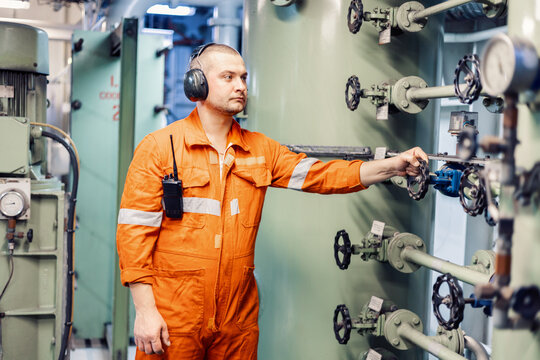 mechanic checks the piping system