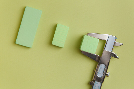 Wooden blocks measured with a calliper